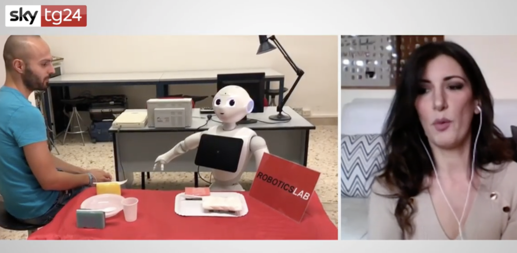 Un robot discute con il suo istruttore sull' opportunità o meno di gettare un oggetto sul pavimento